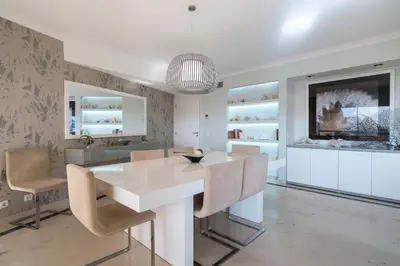 a dining room with a white table and chairs at Marina Mar 'Penthouse' by SAPvillas in Vilamoura