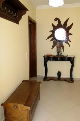 a room with a bench and a mirror on a table at Holiday Home Vila Sol by Interhome in Cabeço de Câmara