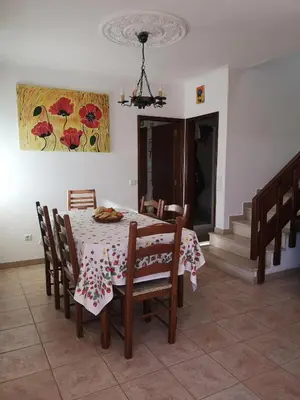 a dining room with a table and chairs at Villa Vacations House in Albufeira