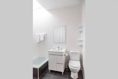 a bathroom with a toilet and a sink and a tub at REMODELED APARTMENT IN THE CITY CENTER. (FARO) in Faro