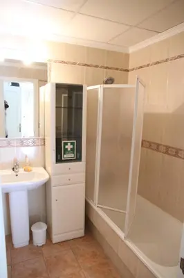 a shower with a shower head in a bathroom at O Pinheiro - Apartment Hannah in Olhos de Água