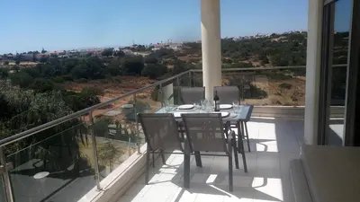 a balcony with a table and chairs on it at Monte da Eira apartments in Albufeira