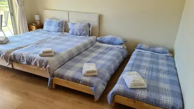two beds in a bedroom with towels on them at Monte da Eira apartments in Albufeira