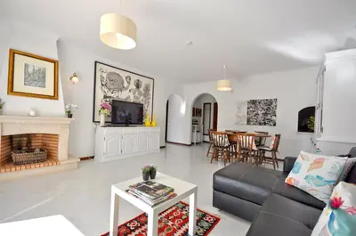 a toilet sitting on the grass in a yard at Charming Villa, Private Pool, Walking Distance to Centre, Free AC Wifi in Quarteira