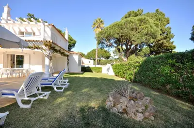 a living room with a couch and a table at Charming Villa, Private Pool, Walking Distance to Centre, Free AC Wifi in Quarteira