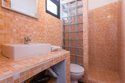 a bathroom with a sink and a toilet at Casa Do Forno - Quinta Amoreira in Faro