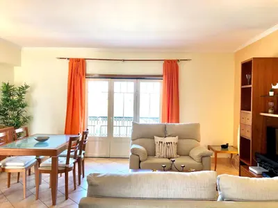 a living room with a couch and a table at Albufeira edificio Marina Inn Pateo in Albufeira