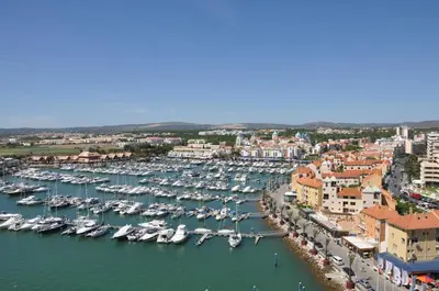 an aerial view of a harbor with boats at Albufeira 2 bedroom apartment 5 min from Falesia beach and close to center H in Albufeira