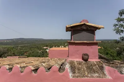 a pink tower on top of a building at Casa Amoreira - Quinta Amoreira in Faro