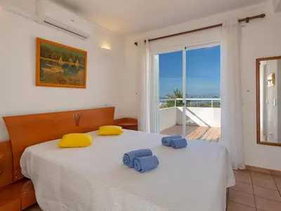 a bedroom with a bed with two towels on it at Villa Villa Blue Ocean by Interhome in Patroves