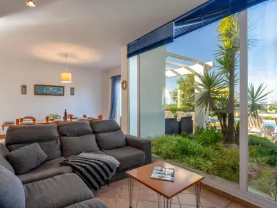 a living room with a couch and a large window at Villa Villa Blue Ocean by Interhome in Patroves