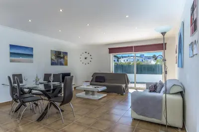 a living room with a couch and a table at FLH Albufeira Vila Mira Flat with Pool in Albufeira
