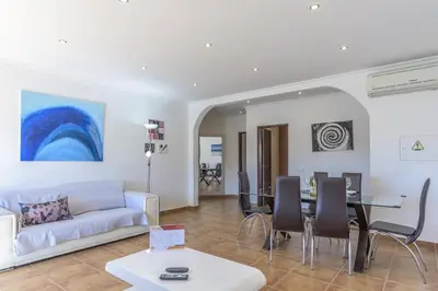 a living room with a couch and a table at FLH Albufeira Vila Mira Flat with Pool in Albufeira