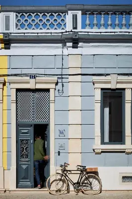 a bike parked in the doorway of a building at Pereiras House of Charm - Downtown in Faro