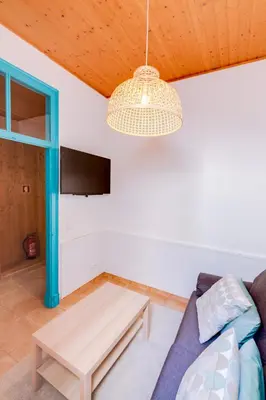 a living room with a couch and a table at TREM - LOCATED IN OLD CITY - FARO in Faro