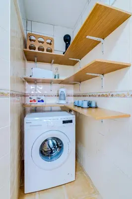 a white washer and dryer in a small kitchen at TREM - LOCATED IN OLD CITY - FARO in Faro