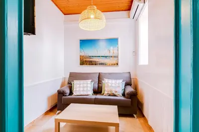 a living room with a couch and a table at TREM - LOCATED IN OLD CITY - FARO in Faro