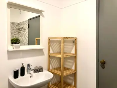 a bathroom with a sink and a mirror at Albufeira I old town and city center in Albufeira