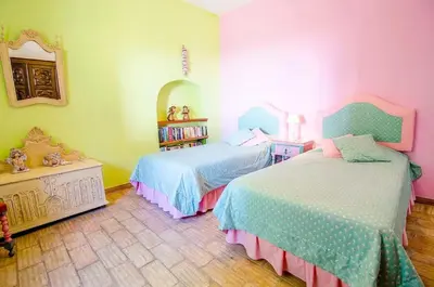 a bedroom with two beds and a mirror at Elegant Villa in Loulé with Private Pool in Loulé