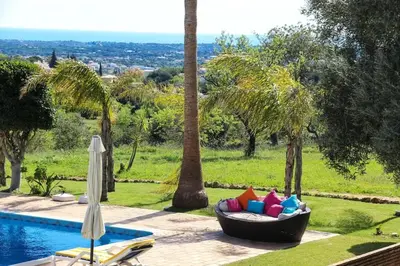 a bean bag chair sitting next to a pool at Elegant Villa in Loulé with Private Pool in Loulé