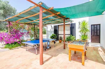 a patio with a ping pong table and a canopy at Elegant Villa in Loulé with Private Pool in Loulé