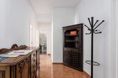 a kitchen with a desk and a refrigerator at Casa Bela in Faro