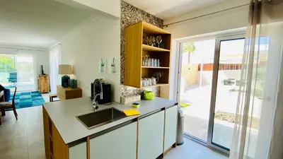a kitchen with a sink and a counter top at Otto by Check-in Portugal in Quarteira