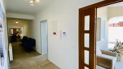 a bedroom with a bed and a mirror at Otto by Check-in Portugal in Quarteira