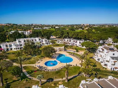 an aerial view of a resort with two swimming pools at Apartament Portes Balaia Golf Resort in Albufeira