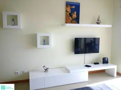 a kitchen with a sink and a counter top at Bright apartment with sea view in Albufeira - 62 m², Pool in Albufeira