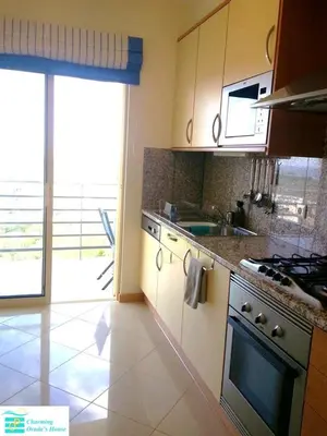 a white counter top with a dresser in a room at Bright apartment with sea view in Albufeira - 62 m², Pool in Albufeira
