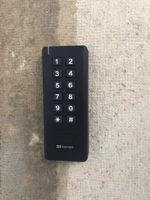 a black remote control sitting on top of a counter at Faro Downtown Ria Formosa I in Faro