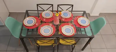 a glass table with plates on top of it at Casa Senhora da Ria- localização perfeita em Faro in Faro