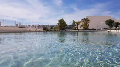 a large pool of water in front of a building at Albufeira, Sea View (25) in Albufeira