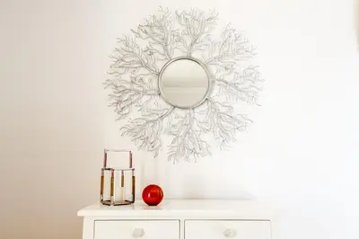 a mirror on a wall above a white dresser at Endless Summer Luxury Villa in Quinta do Lago