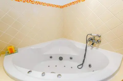 a bath tub with a hose in a bathroom at Endless Summer Luxury Villa in Quinta do Lago