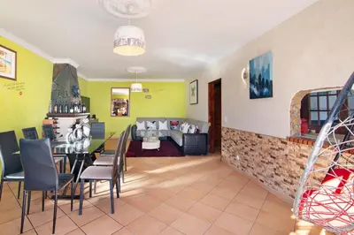 a restaurant with a table and chairs in a room at Villa Calipso in Albufeira