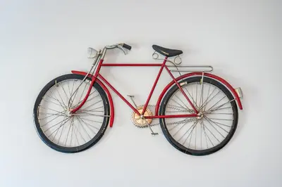 a red bike is hanging on a wall at Villa Simone by Intiholidays in Quarteira