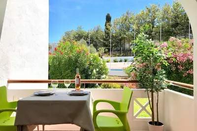 a swimming pool in front of a building at Albufeira + appartement proche plage avec piscine in Albufeira