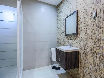 a bathroom with a sink and a mirror at V4, Villa Jardins Branqueira3 near Beach, Albufeira in Albufeira