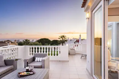 a balcony with a view of the ocean at WHome | Prime Hideaway Luxury Villa in Quarteira