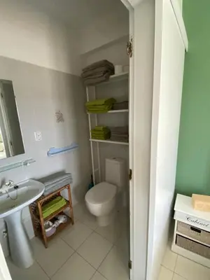 a bathroom with a toilet and a sink at Casa da azinheira in Loulé