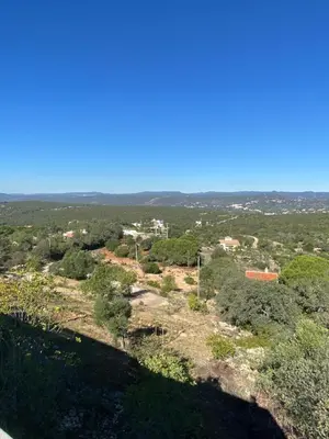 a view of a city from a hill with trees at Casa da azinheira in Loulé