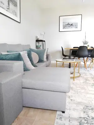 a living room with a couch and a table at Feliz Algarve in Albufeira