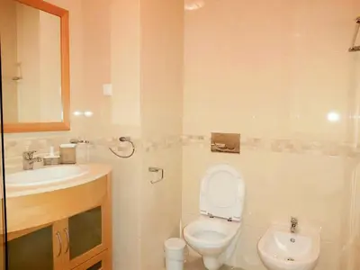 a bathroom with a toilet and a sink at Sunny Apartment with sea view in Albufeira in Albufeira