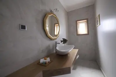 a bathroom with a sink and a mirror on the wall at Casa Corais in Guia
