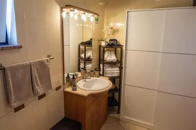 a hallway leading to a living room with a light fixture at Charm Apartment T2 All With Big Terrace Albufeira Self check-in in Albufeira