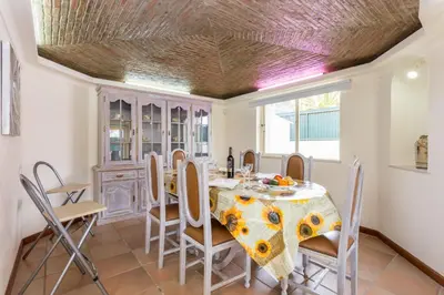 a dining room with a table and chairs at Helmar by Algarve Villa Holidays in Galé
