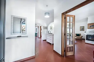 an open living room with white walls and a door at Íris by Algarve Villa Holidays in Galé