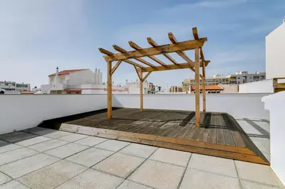 a wooden chair sitting on top of a roof at Casa Azul Traditional House - Faro in Faro